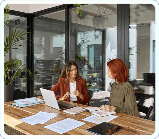 Two Professionals Discussing Salesforce Consulting Strategies in a Modern Office Setting